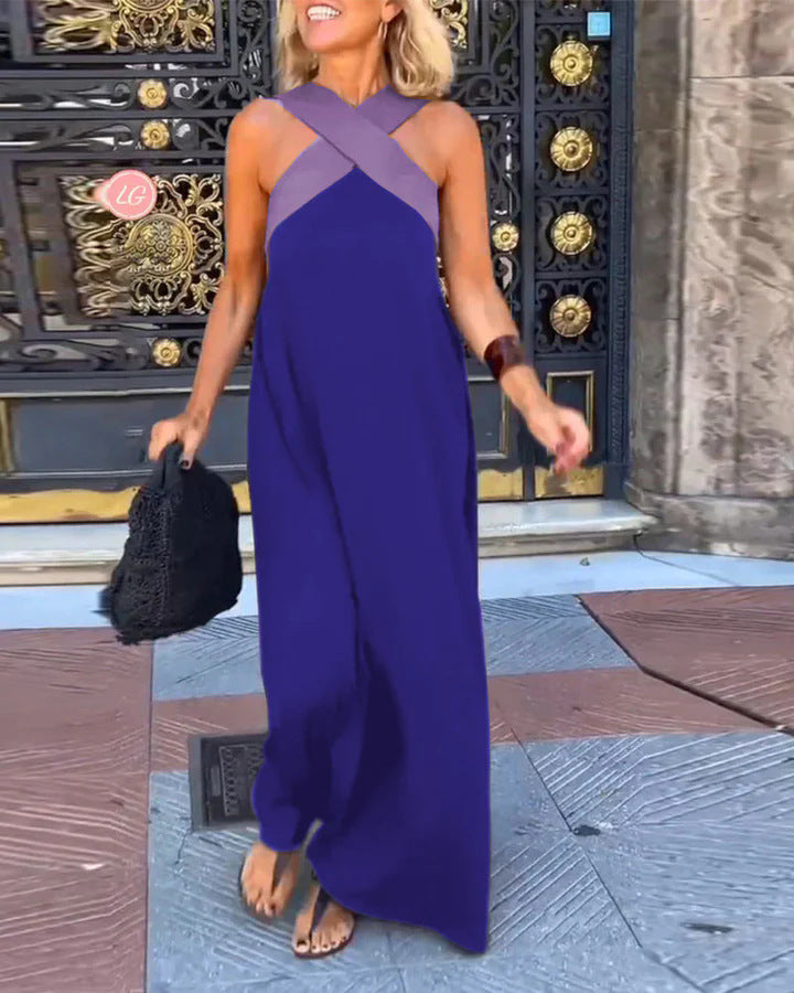 Stylish women's cross-neck maxi dress, elegant & versatile for various occasions. Flowing design.