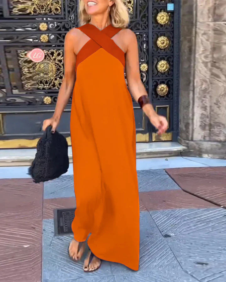 Summer-ready elegant cross-neck maxi dress, flowing & comfortable for warm days. Versatile style.