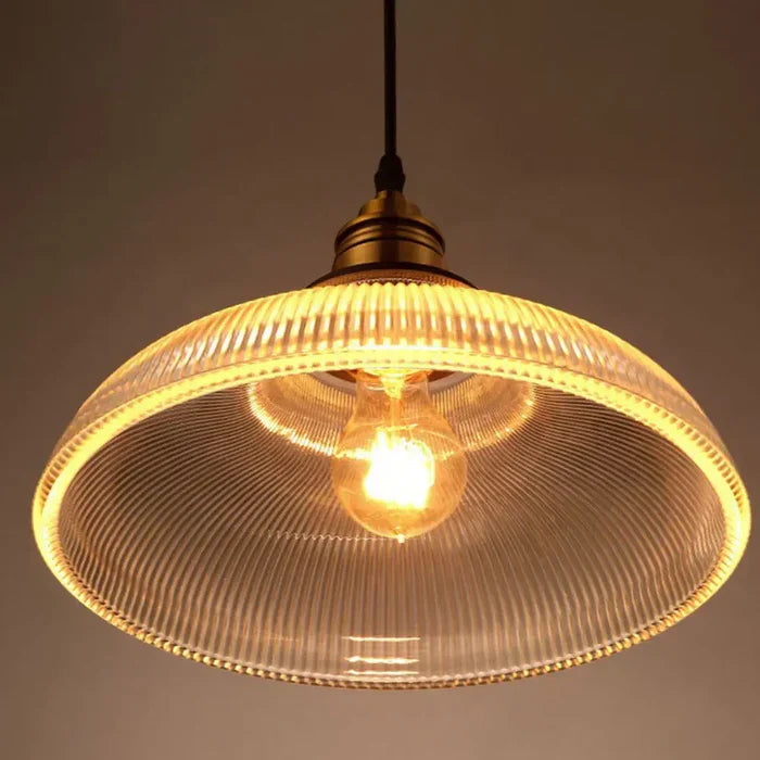 Sophisticated glass pendant light creating an elegant warm white glow, ideal for contemporary homes.