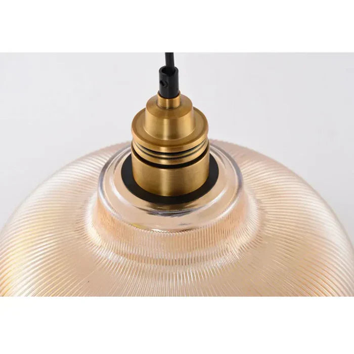 Beautiful modern glass pendant light, an elegant home decor ceiling lamp with a soft warm white glow.