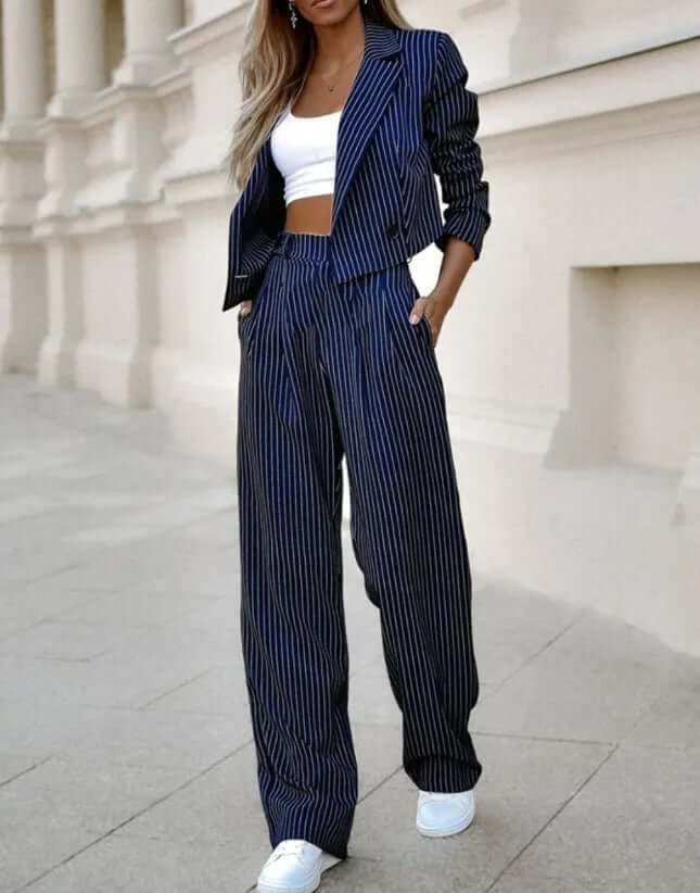 Elegant dark blue women's two-piece set. Tailored polyester blend, perfect for office wear or special occasions.