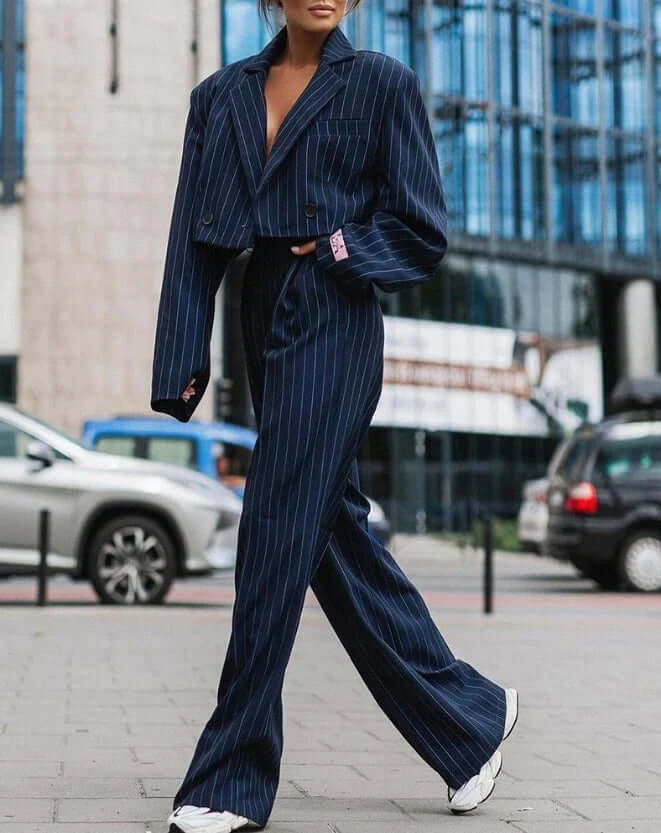 Stylish gray women's two-piece coordinated outfit. Versatile tailored set for dressy or casual chic fashion.
