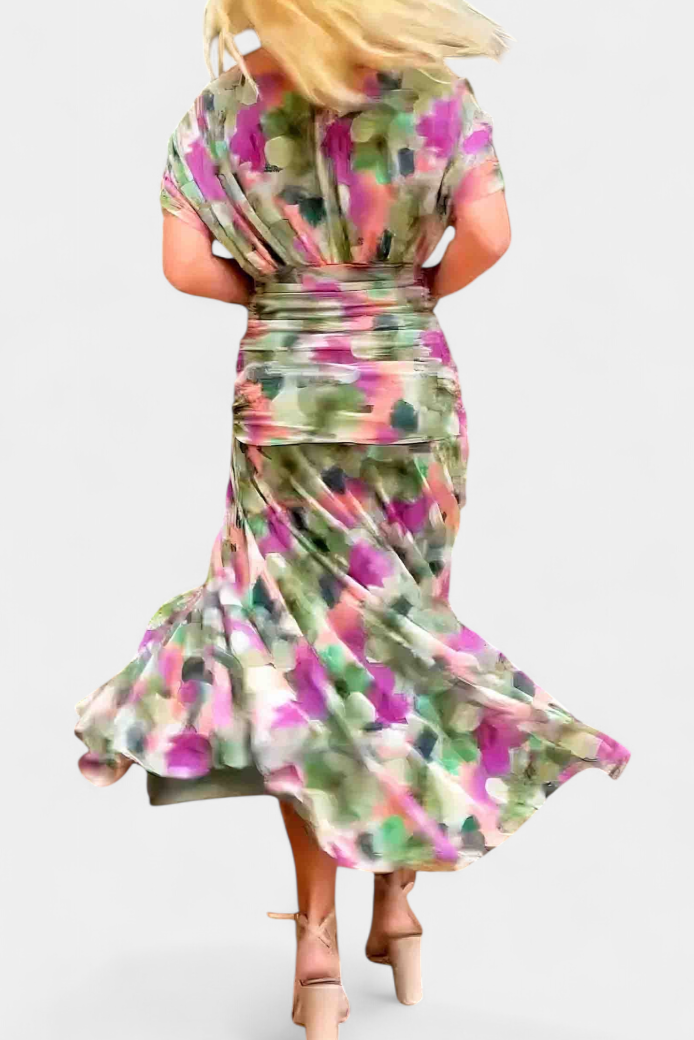 Women's elegant off-shoulder floral maxi dress on hanger, flowing purple & pink summer party wear.