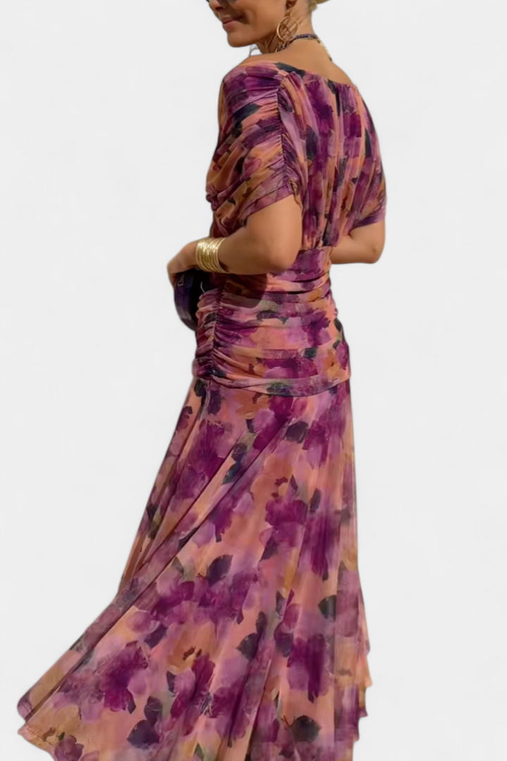 Women's elegant off-shoulder floral maxi dress, perfect flowing purple & pink summer occasion wear.