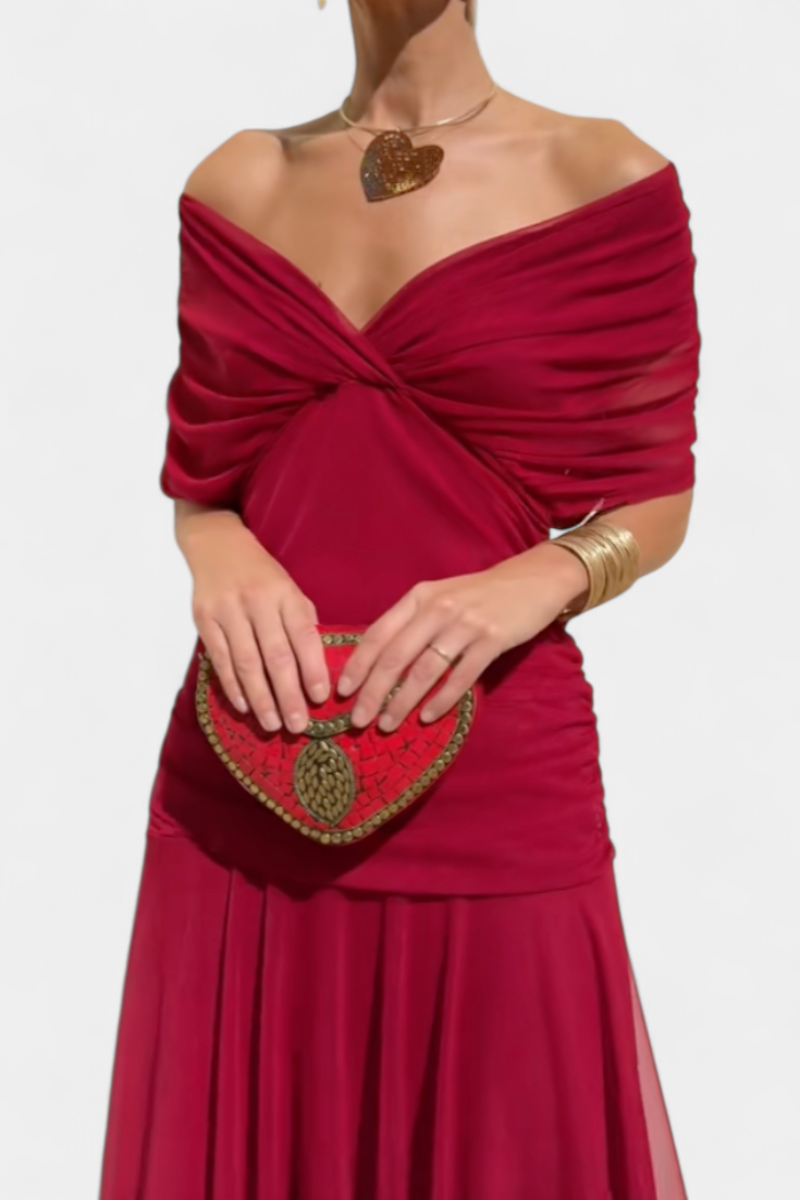 Back view of women's elegant flowing off-shoulder floral maxi dress in purple & pink, summer party.