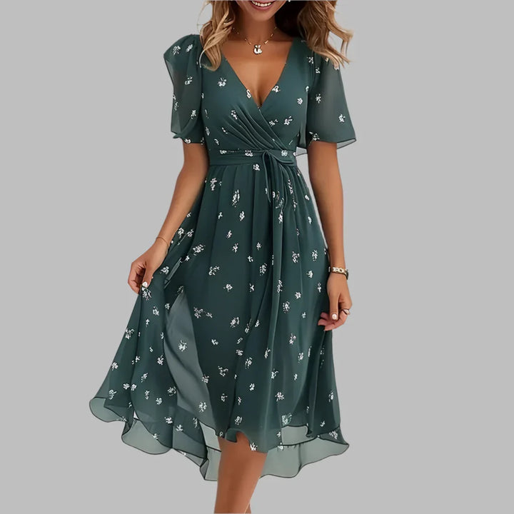 Sweetheart neckline floral midi dress for women. Features elegant ruching, puff sleeves & flowy skirt.