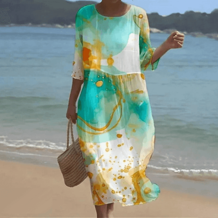 Chic women's flowy midi dress, ideal as an elegant summer dress for any event.