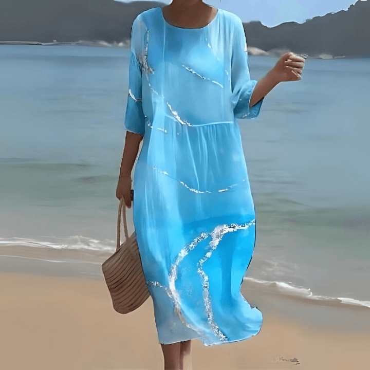 Comfortable women's midi dress featuring a graceful A-line silhouette & effortless flowy design.