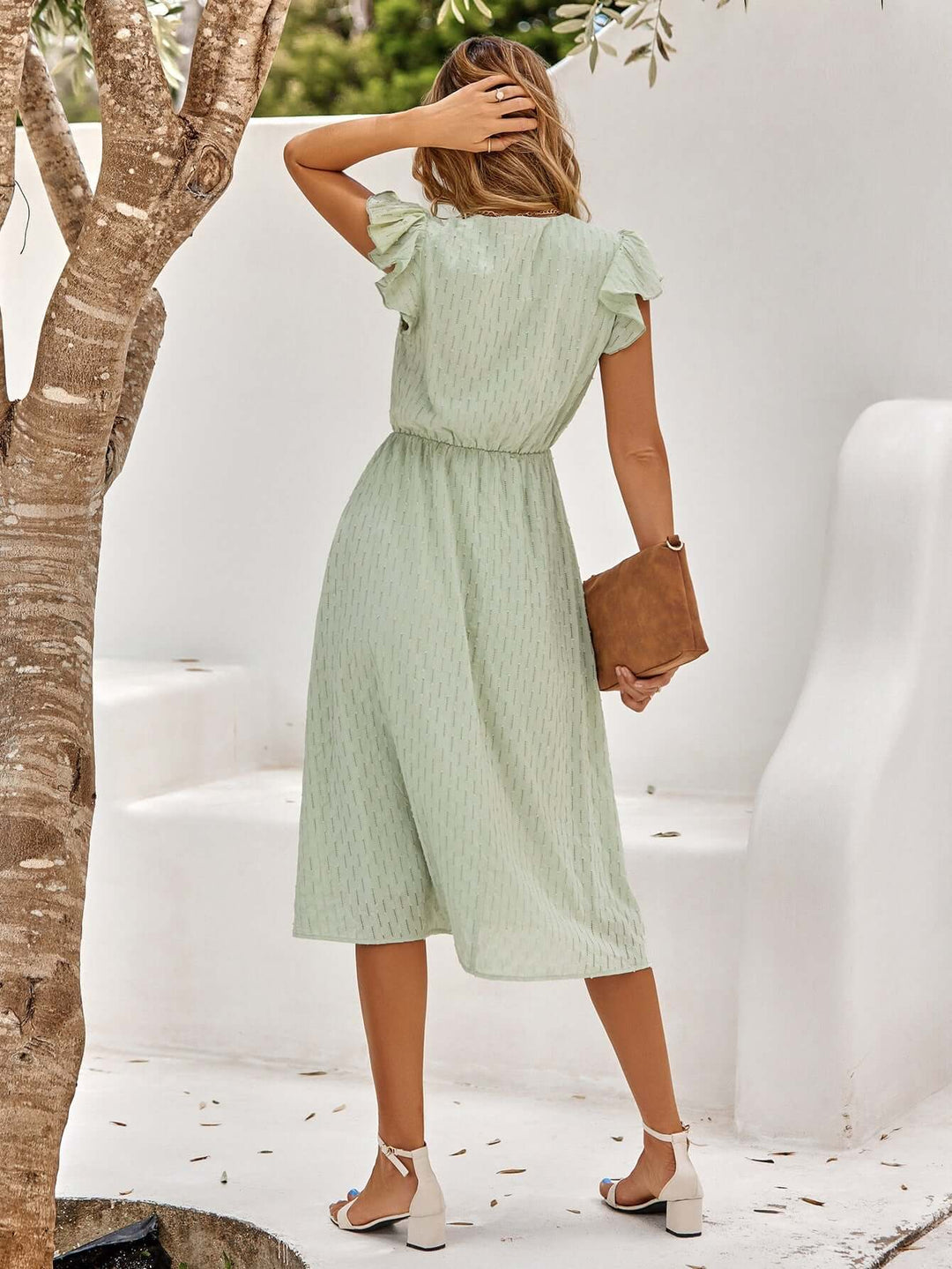 Comfortable women's flowy V-neck midi dress with ruffled sleeves. An elegant summer dress for any occasion.