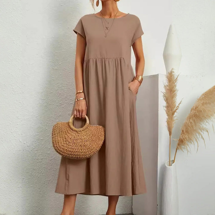 Women's elegant long flowy maxi dress, offering sophisticated style for any summer occasion.