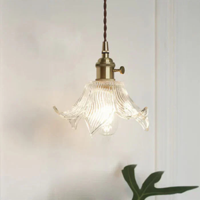 Elegant glass pendant lamp, perfect for modern dining rooms & kitchen islands. OpulentGlow transparent design.