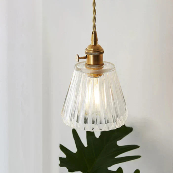 Dining room elegant glass pendant, transparent hanging light with modern appeal for home decor.