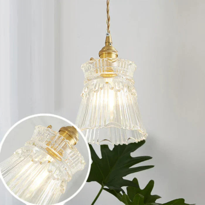 Industrial style transparent glass pendant lamp for elegant dining room lighting & modern homes.