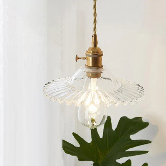 Elegant transparent glass hanging lamp for dining room lighting & modern decor, single bulb design.