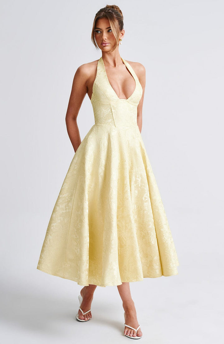 Flattering Pink Halter Midi Dress, a chic sleeveless option for summer cocktails.