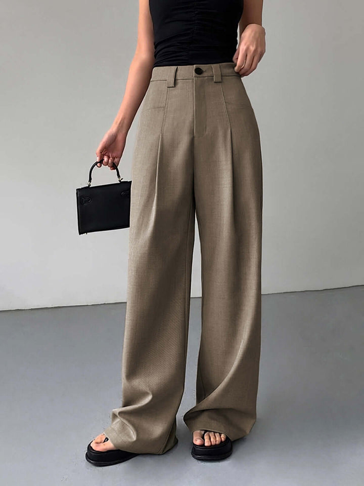 Elegant high-waisted wide-leg women's trousers, perfect for chic fashion & comfort. Versatile pleated design.