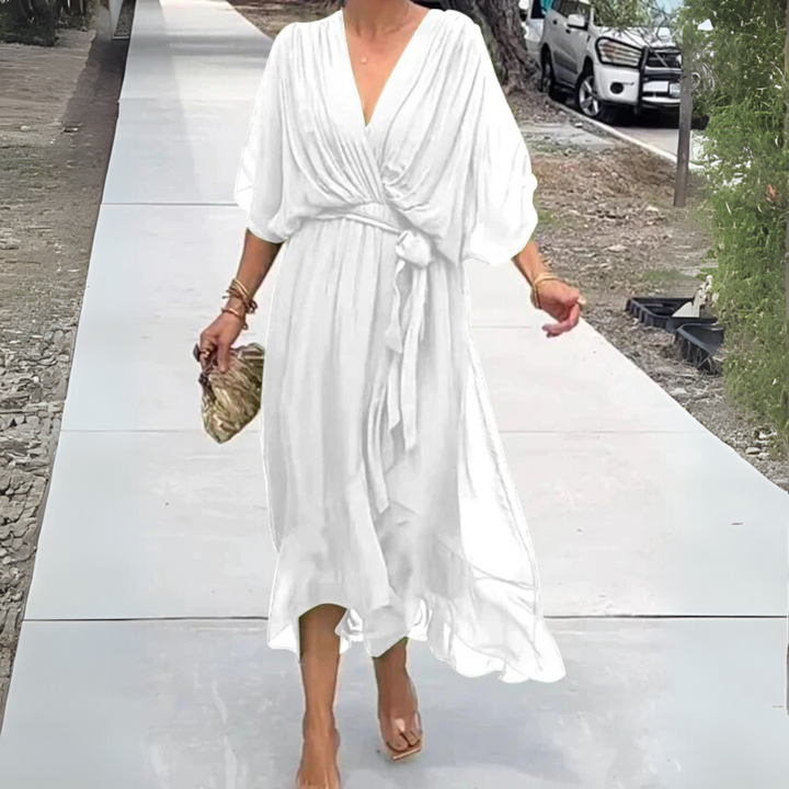 Elegant lightweight women's wrap dress for summer. Features a flattering V-neck, adjustable fit, perfect for day to night.