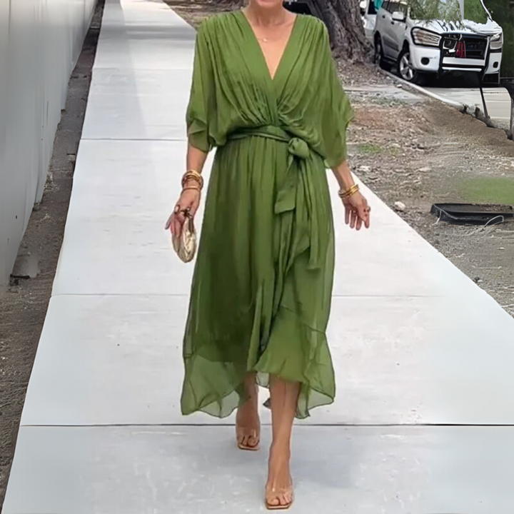 Lightweight women's summer wrap dress. Elegant V-neck design, perfect for day to night wear. Adjustable and comfortable.