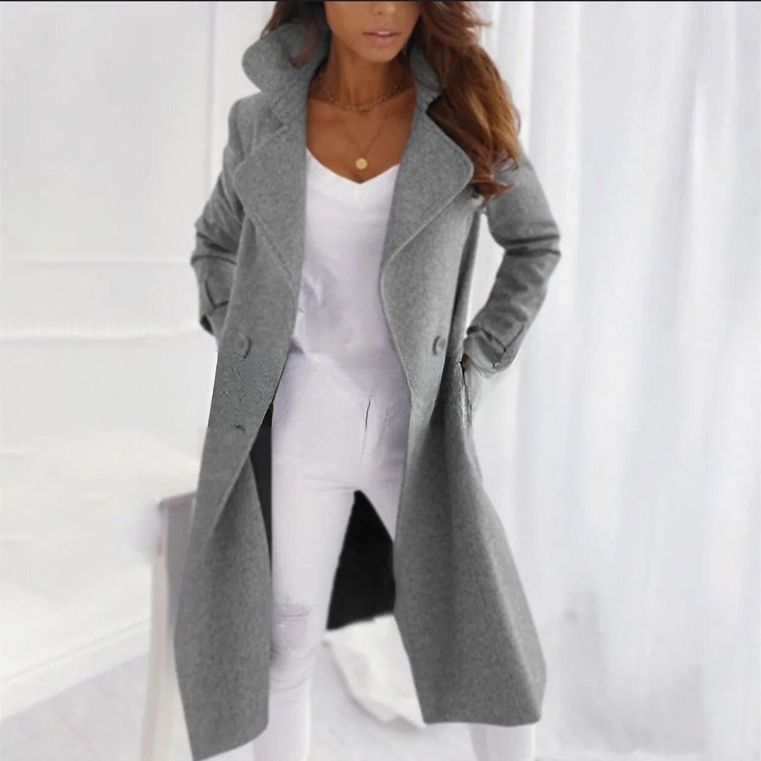 Elegant long women's coat with classic turned-down collar, perfect for fall and winter fashion.