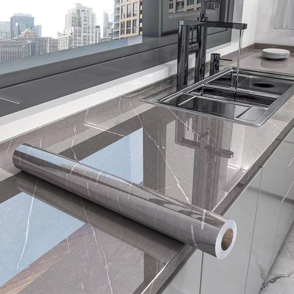 Elegant marble self-adhesive kitchen film, oil-resistant & waterproof for countertops & backsplashes.