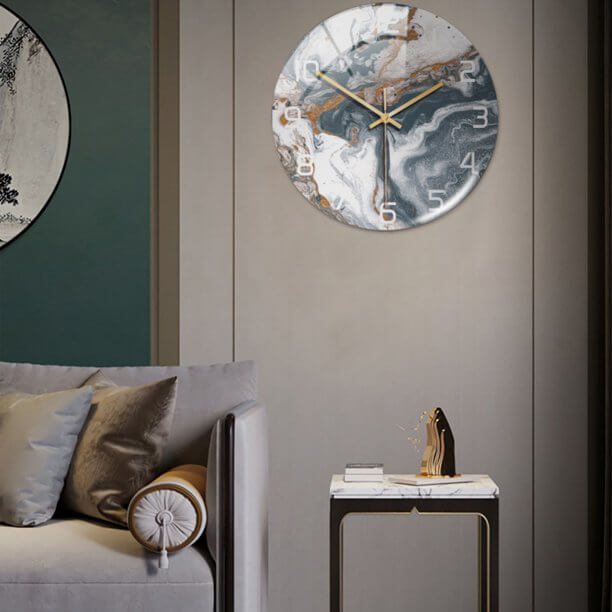 Modern wall clock in an elegant marble finish, enhancing any bedroom or office space.