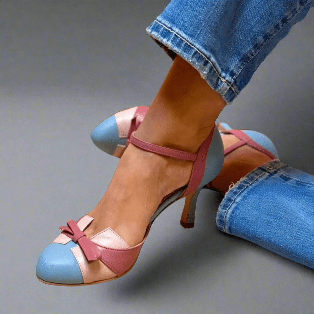 Elegant orthopedic heeled sandals for women with a delicate bow detail, made from vegan leather.
