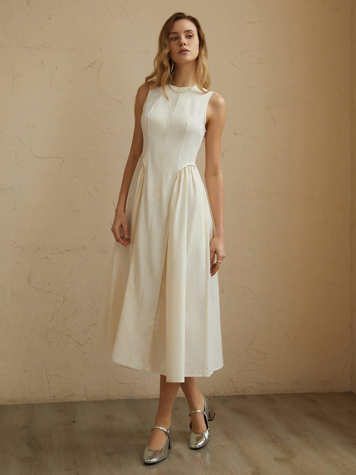 Stylish black pleated midi dress for women, comfortable and flowing, ideal for various occasions.