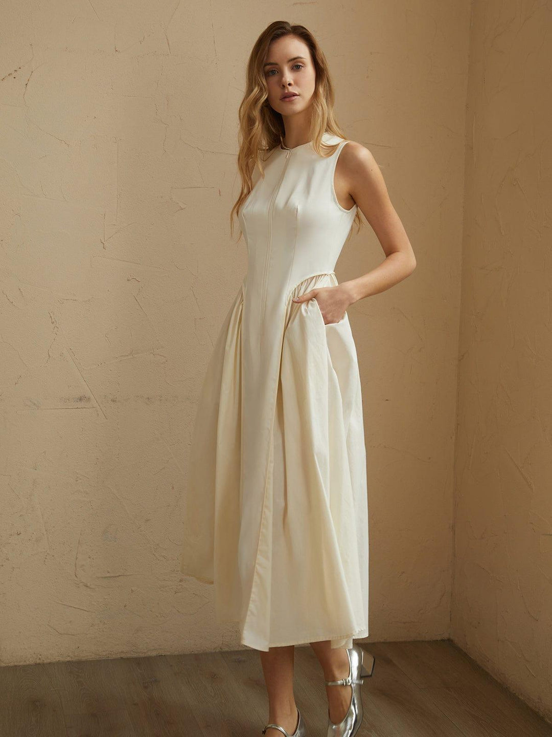 Flowing pleated midi dress for women, elegant & comfortable. Available in off-white and black for versatile styling.