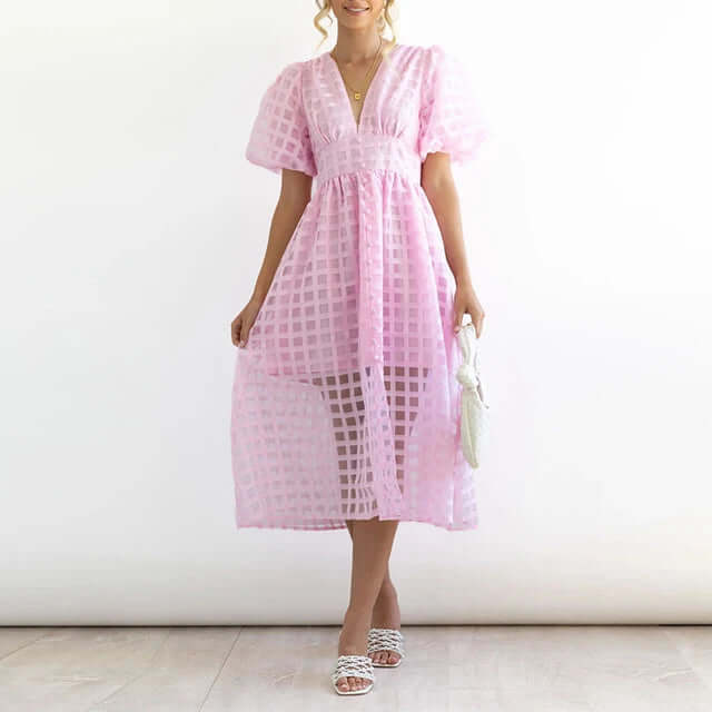 Close-up of a women's elegant polyester casual dress, showcasing fabric and details.