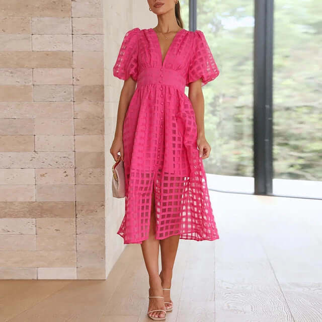 Woman in a chic polyester midi dress, embodying effortless casual style.