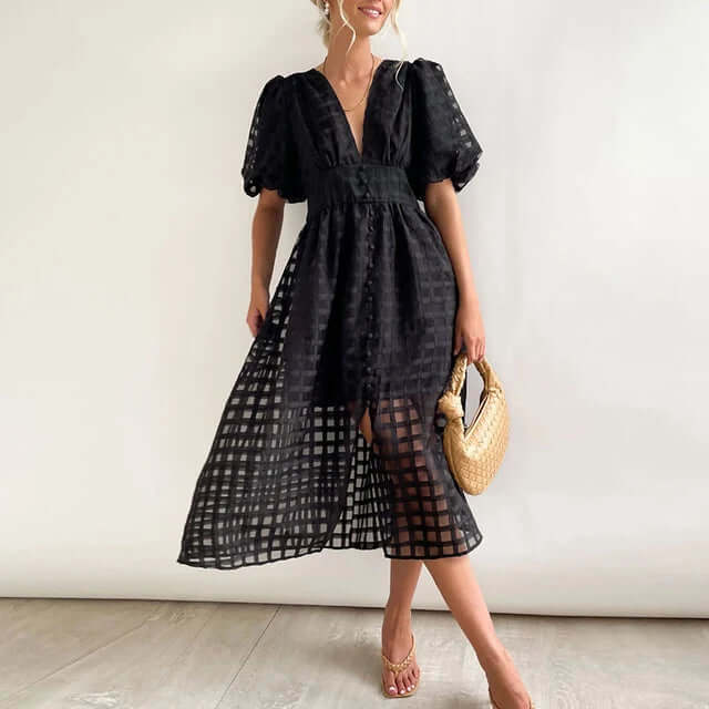 Full-length view of a women's elegant polyester midi dress, showcasing its flattering silhouette.
