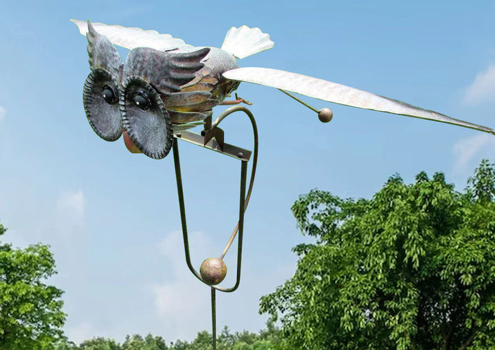 Charming owl-themed rotating garden windmill sculpture, outdoor metal art decor.