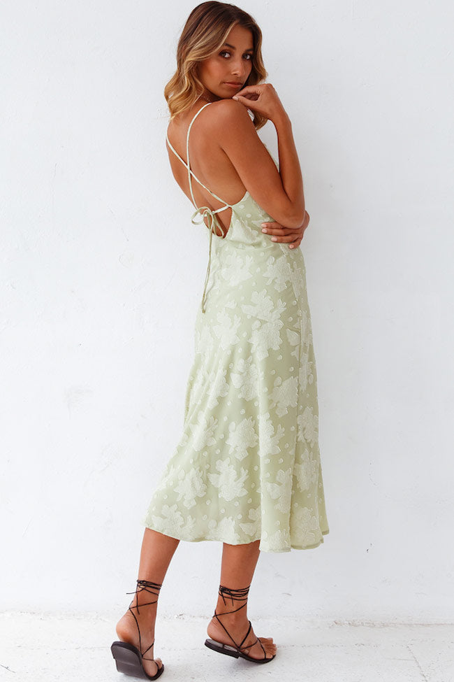Stylish women's summer party dress: a sage green floral cowl neck slip midi, ideal for evenings.