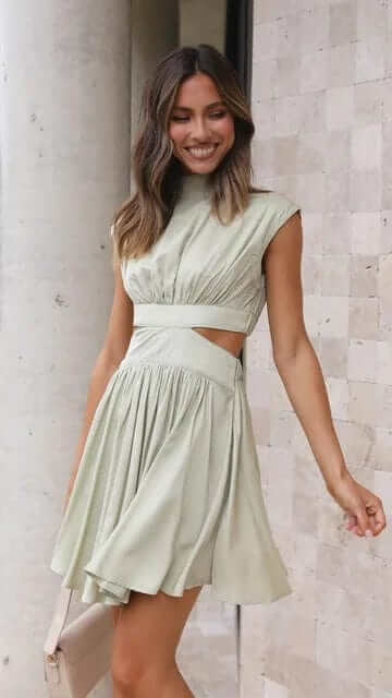 Elegant short summer dress for women, perfect for chic daywear or sophisticated evening events.