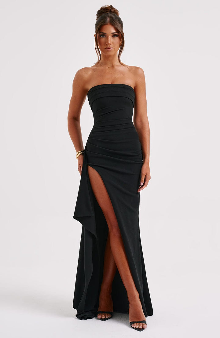 Stunning black strapless maxi dress for women, featuring a flattering thigh slit; perfect party or formal wear.