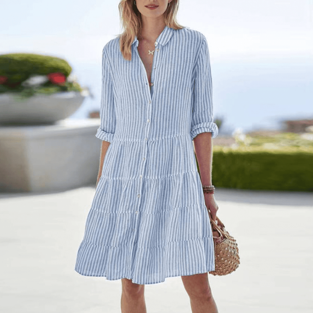 Flattering women's striped midi dress, elegant design & comfortable fabric for versatile spring/summer wear.