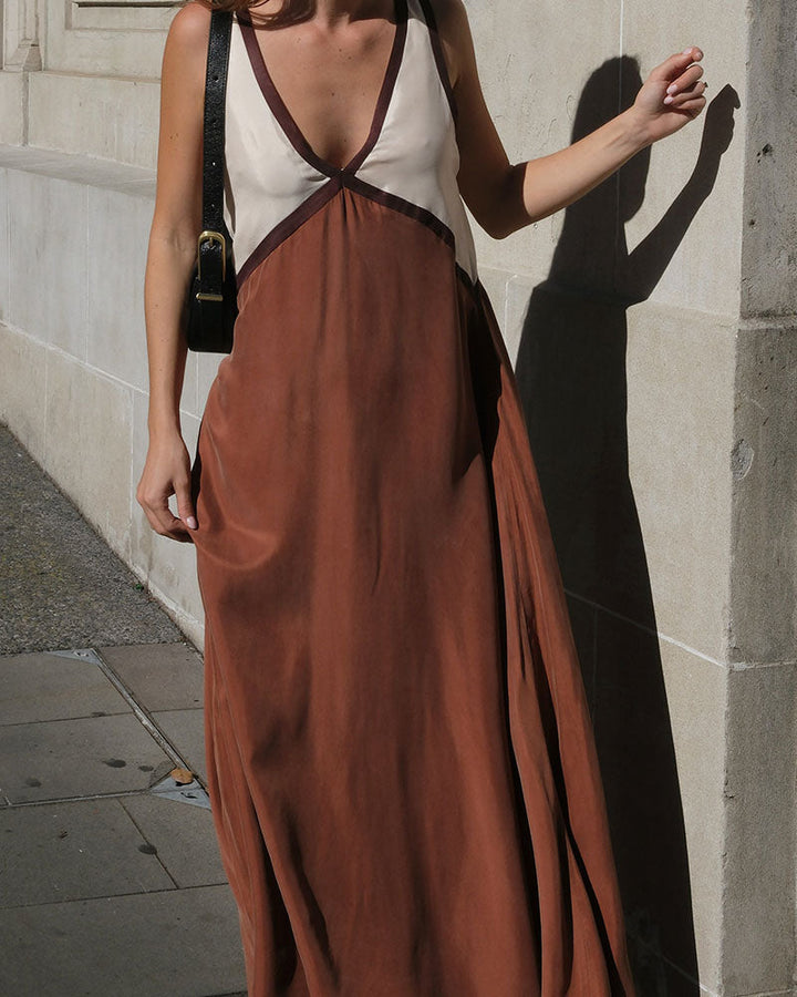 Fashion-forward elegant women's maxi dress, with a stylish V-neck and contrast color block.