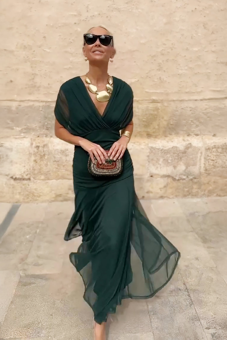 Vibrant fantasy print maxi dress for women, elegant V-neck party wear, flowing and sophisticated.