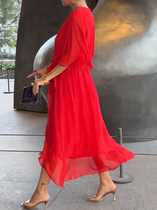 Flowing V-neck short sleeve evening dress, an elegant party wear choice for women.