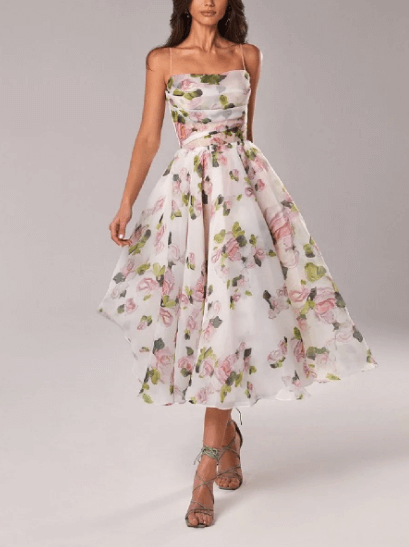 Women's elegant V-neck midi dress, sleeveless polyester summer flowy design, great for casual occasions.