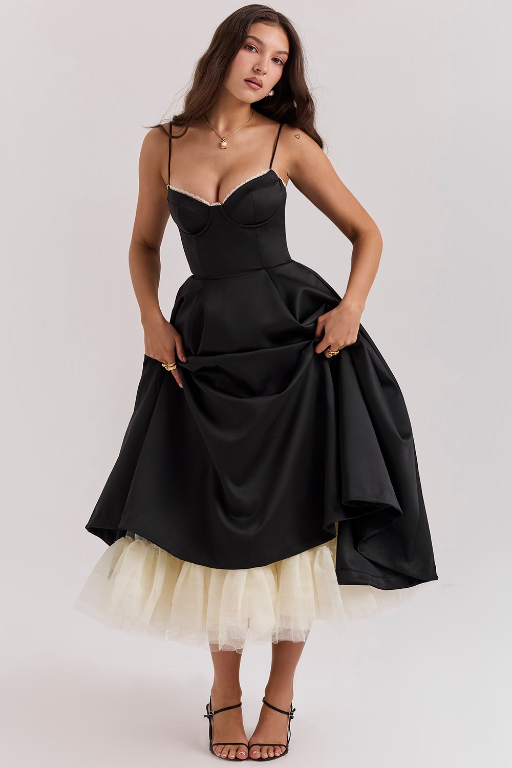 Vintage-inspired women's dress with a flattering corset top & flowing skirt.