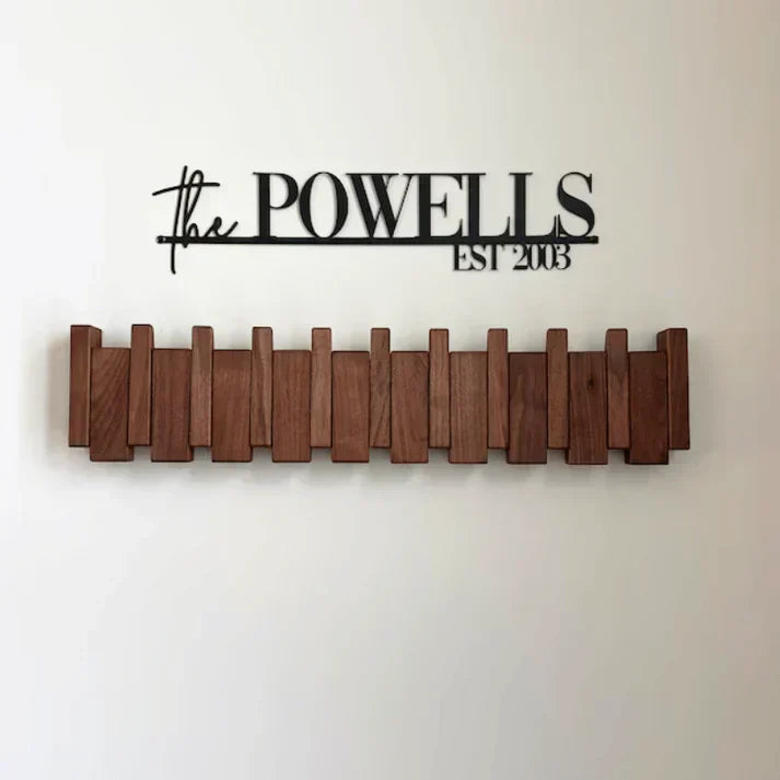 Maximize entryway space with this unique wall-mounted piano coat rack, a stylish and functional storage solution.