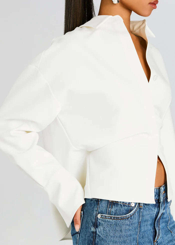 White draped button-down shirt for women. Perfect elegant workwear blouse for a minimalist and chic style.