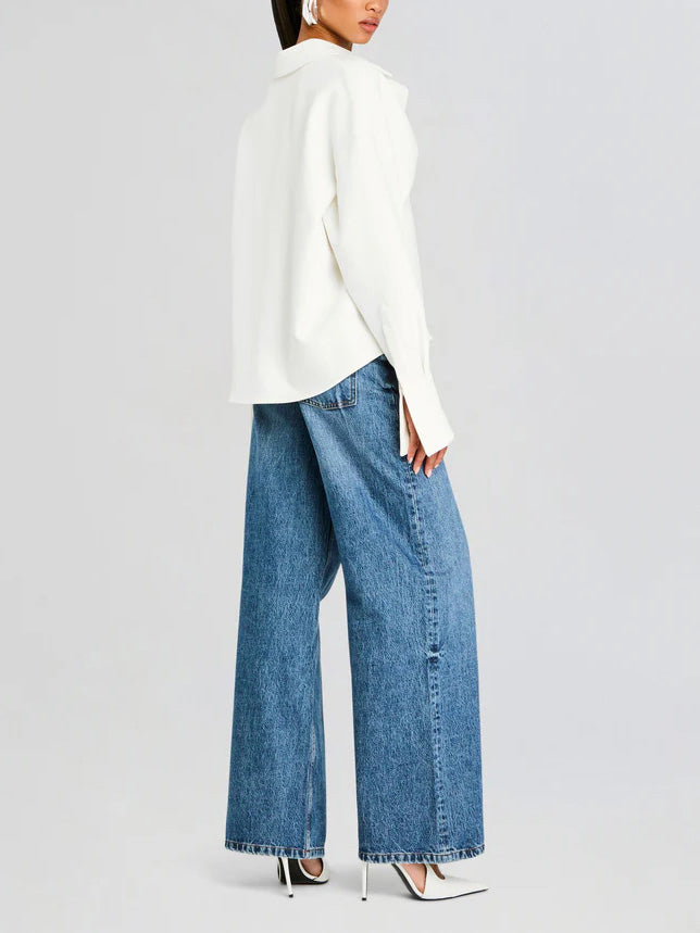 Stylish women's white draped button-down shirt. Elegant blouse for versatile, smart-casual and professional wear.