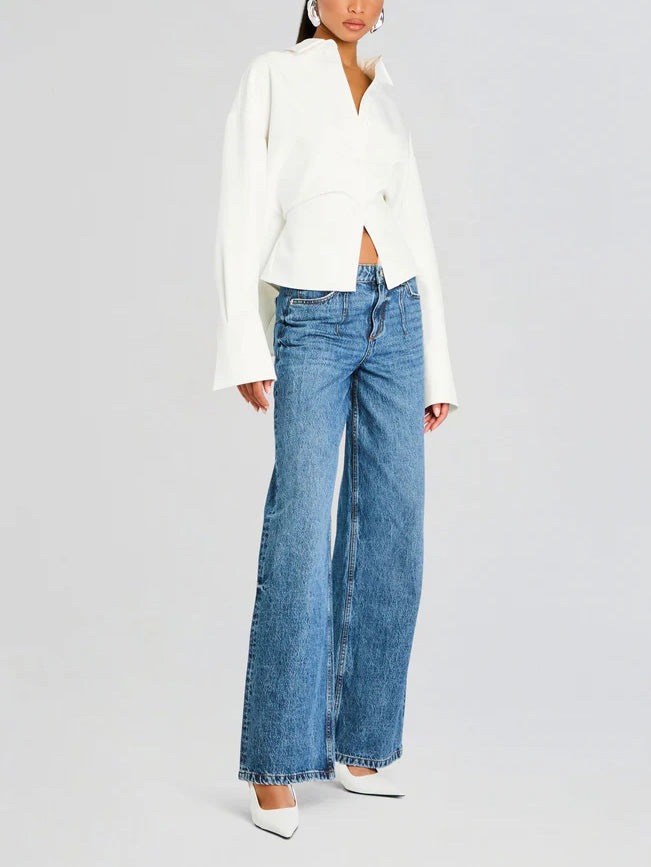 Fashionable white draped button-down shirt. Comfortable yet elegant women's blouse, ideal for versatile styling.