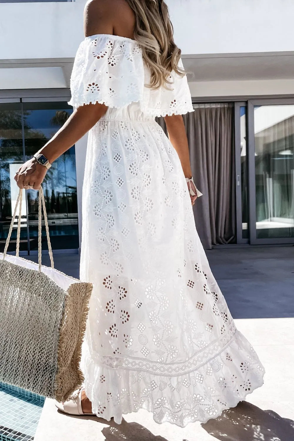 Stunning ruffled white high-low dress for women, featuring a chic off-shoulder design, ideal for parties.