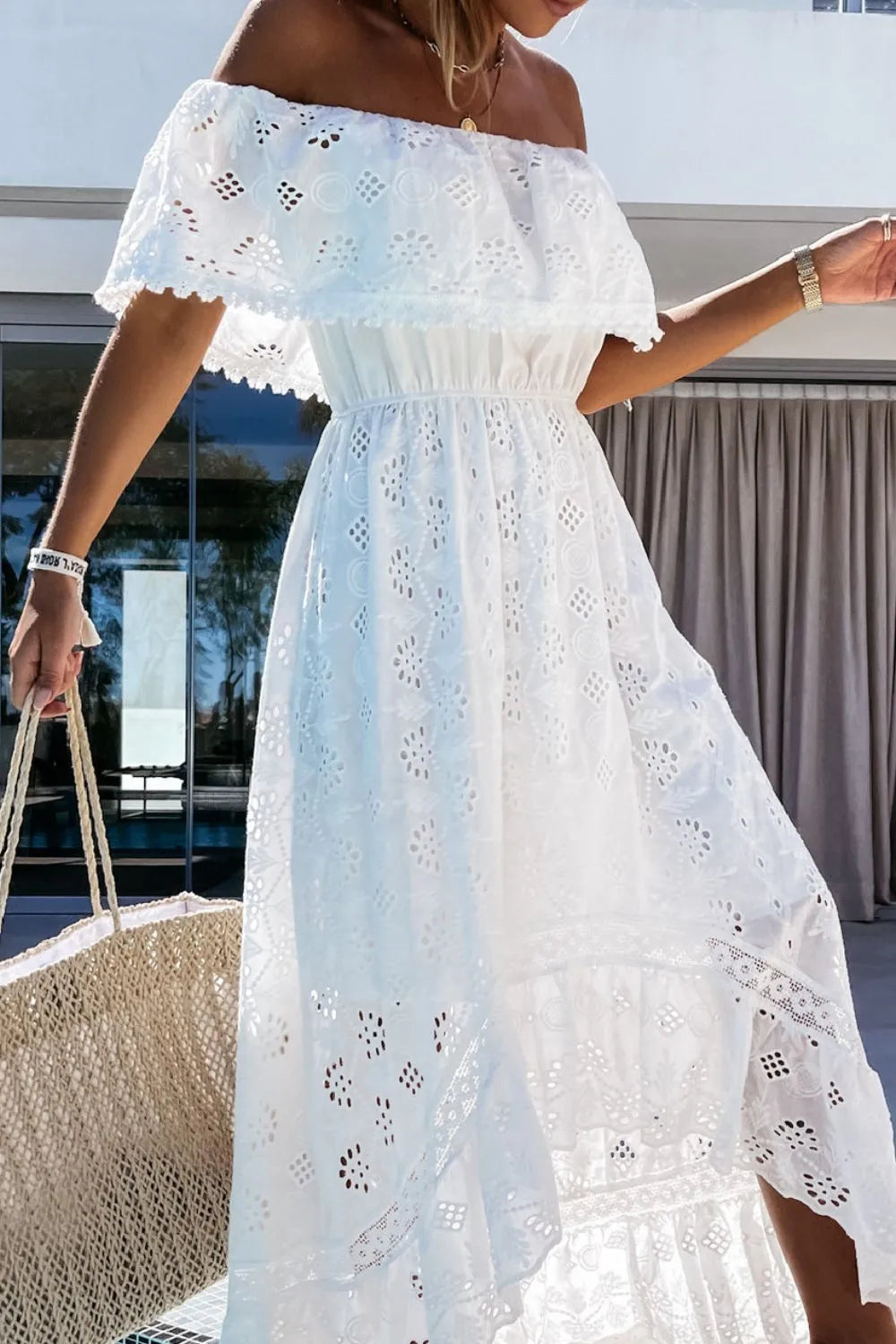 Breathable white off-shoulder high-low summer dress for women, offering style & comfort for party guests.