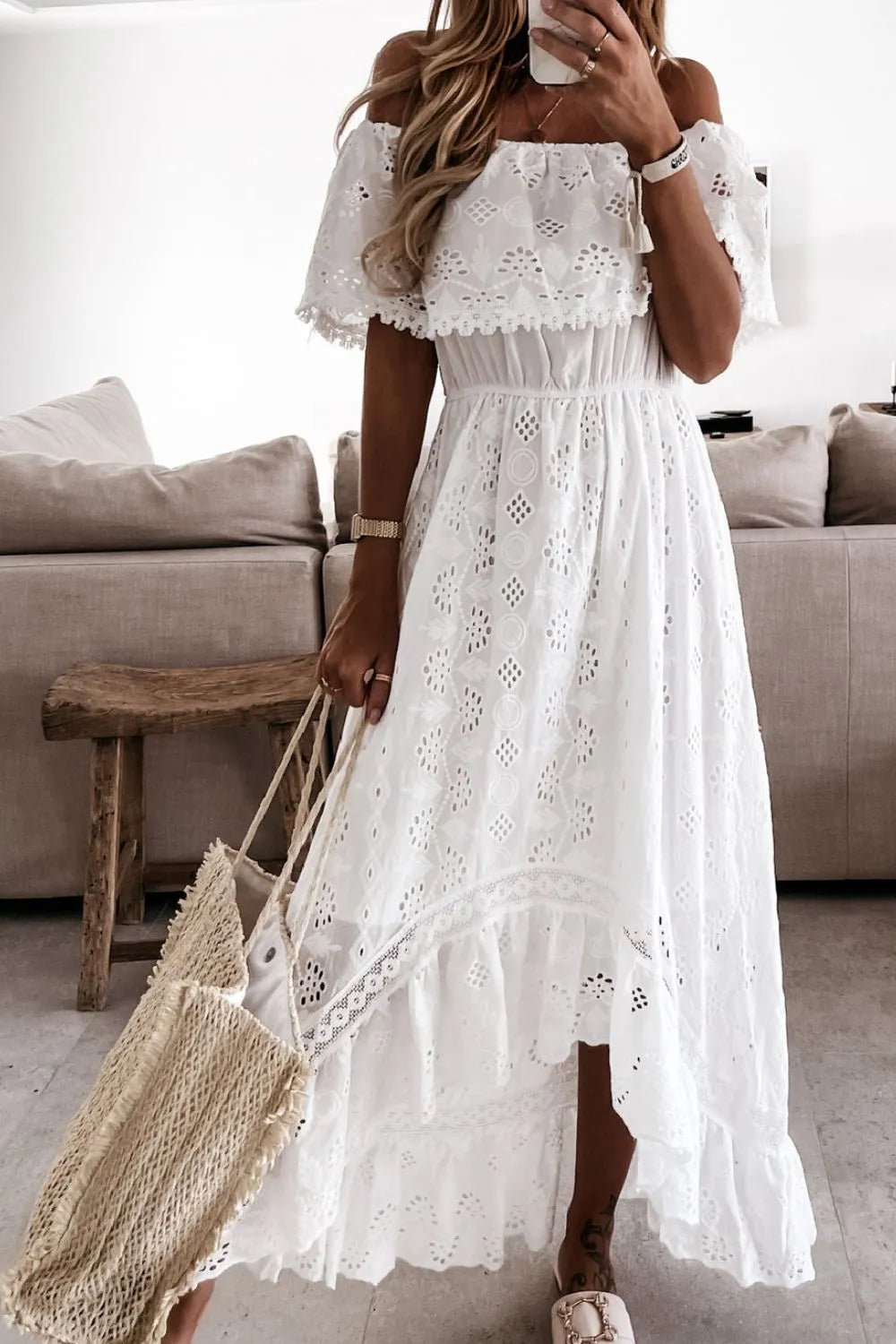 Versatile white off-shoulder high-low dress with delicate ruffles, perfect for women's special occasion wear.