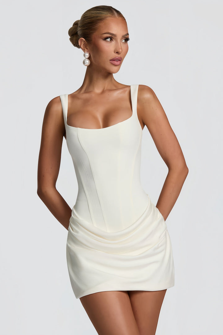 Stunning white ruched mini dress for women. Elegant bodycon style, perfect for evening, party, or cocktail events.
