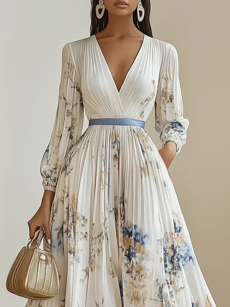 Women's elegant flowy maxi dress with V-neckline & stylish puff sleeves. A comfortable and timeless choice for special events.